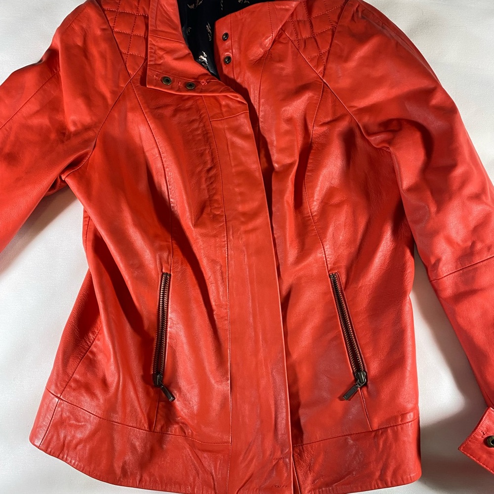 Orange leather jacket thrifted in paris M